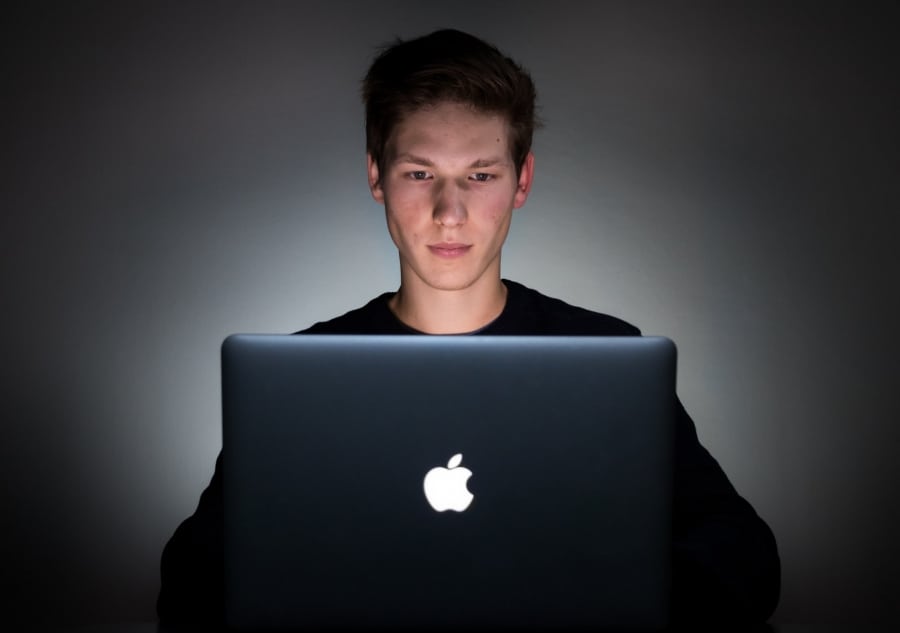 man using macbook